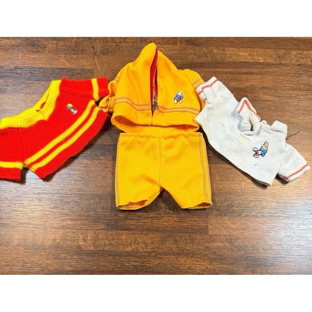 Vintage Smurf doll clothes.  Sweater, athletic outfit.